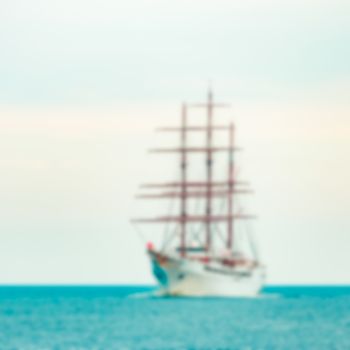 White sailing ship - soft lens bokeh image. Defocused background