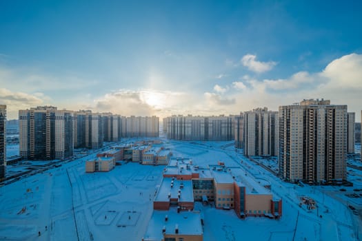 New modern residential building against blue sky in winter