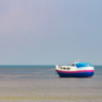 Blue passenger ship - soft lens bokeh image. Defocused background