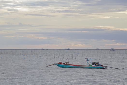 fishing boats go out to sea in the evening.