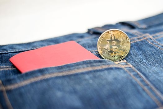 Passport in jeans and bitcoins, the concept of modern puies.