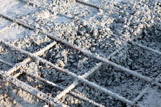 Closeup shot of construction site reinforcing metal bars of industrial floor