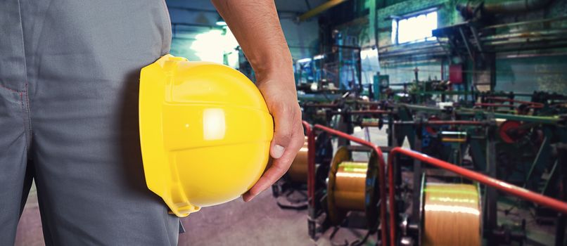 Worker with safety helmet at industrial factory