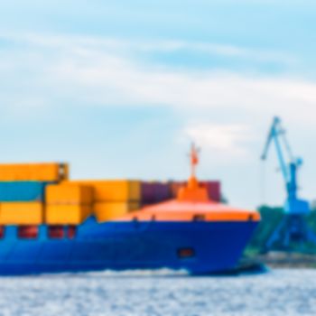 Blue cargo ship - soft lens bokeh image. Defocused background