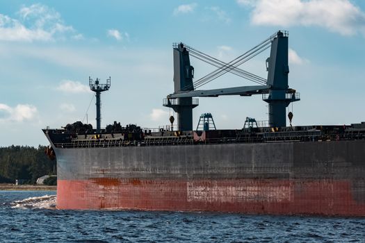 Black bulker ship. Logistics and merchandise transportations