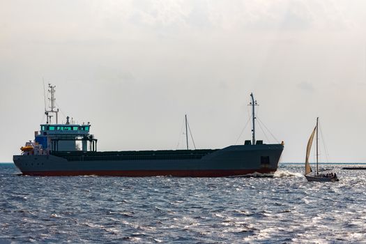 Grey bulker ship. Logistics and merchandise transportations