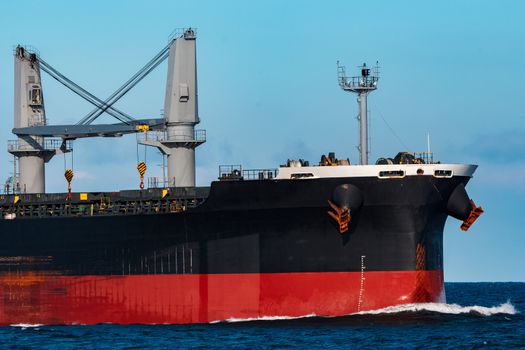 Black bulker ship. Logistics and merchandise transportations