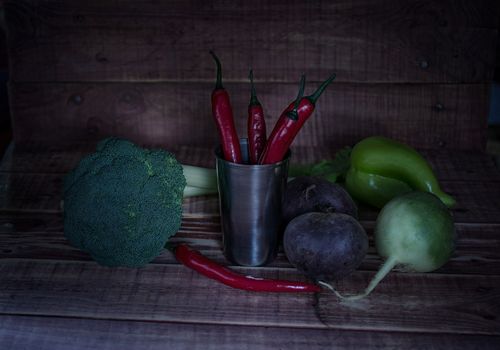 still life with natural vegetables, beets, peppers, radish broccoli