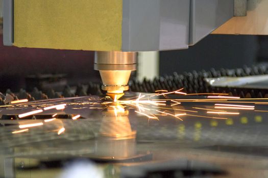 CNC laser cut machine while cutting the sheet metalCNC laser cut machine while cutting the sheet metal