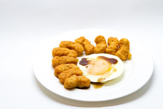 Fried egg with chicken snack