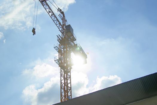 Lifting crane of reverse solar with blue sky
