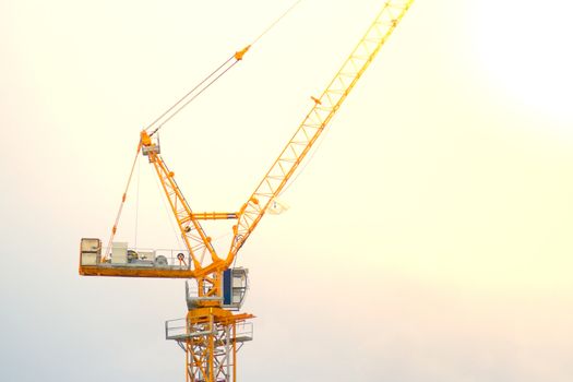 Yellow lifting crane Prepare to start In blue sky