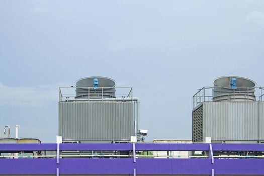 Cooling towers on daylight on the purple floor