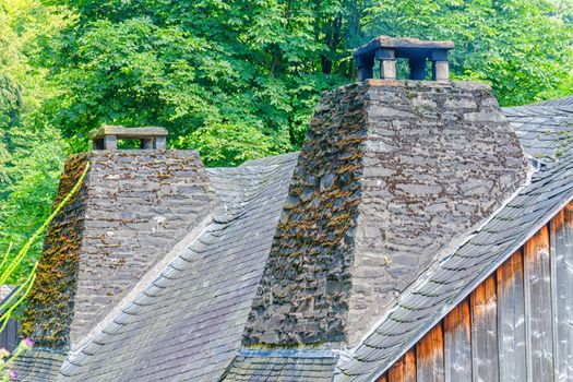 Double chimney made of natural stone