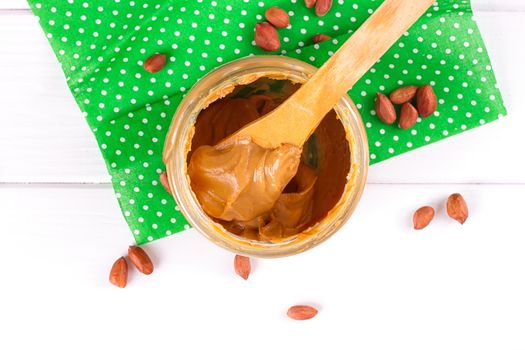 an open jar of peanut butter with spoon