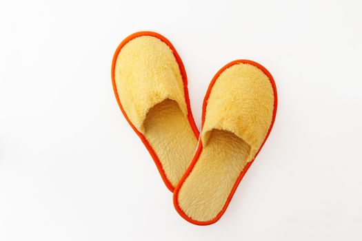 multicolored soft fluffy house slippers isolated on white background.