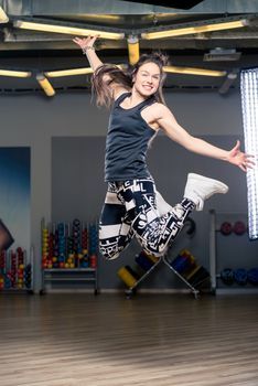 jumping young dancer during a dance in the gym