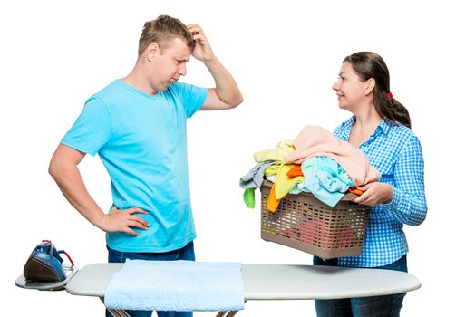 woman showing her husband a laundry cart for ironing, a portrait is isolated on a white background