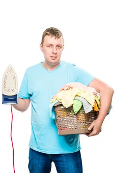 portrait of a man with an iron and a basket of clean linen on a white background