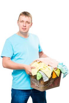 vertical portrait of a man with a basket of clean linen on a white background