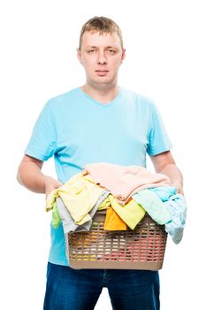 portrait of a man with a basket of clean laundry for ironing on a white background isolated