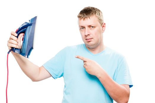 serious man showing thumb on iron on white background