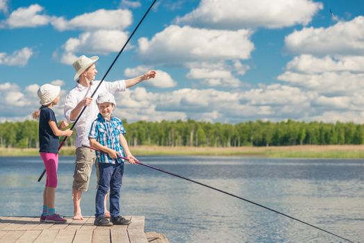 girl and boy with dad learn to fish, weekend fishing