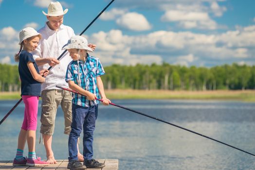 ather teaches children to fish big fish