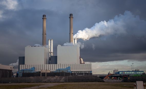 smoke and polluton from industrial chimney from power plant rotterdam maasvlakte