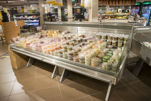HILVERSUM,HOLLAND,09-01-2018:supermarket in holland with racks full of drinks and food like beer, milk snacks and fastfood in Hilversum, hilversum is the media city of holland