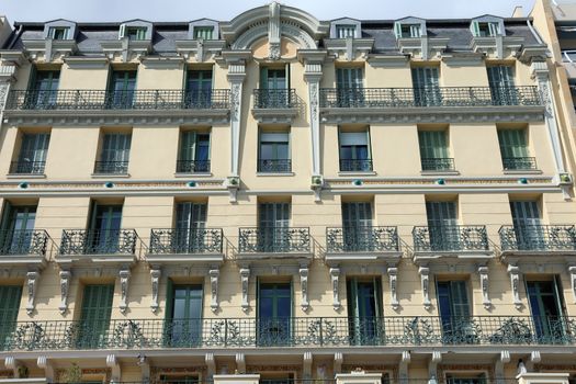 Facade of Traditional Building of French Riviera With Many Windows And Balconies