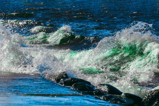 Summer ocean beach with green waves at sunny day