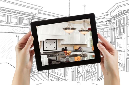 Female Hands Holding Computer Tablet with Kitchen on Screen &amp; Drawing Behind.