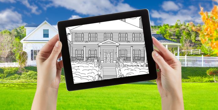 Female Hands Holding Computer Tablet with House Drawing on Screen, Photo Behind.