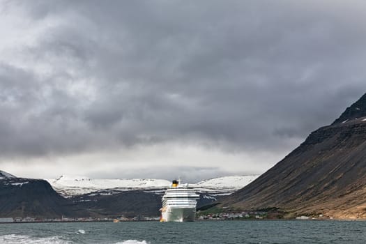 Cruise ship stopped in Isafjordur in a cloudy day, Iceland