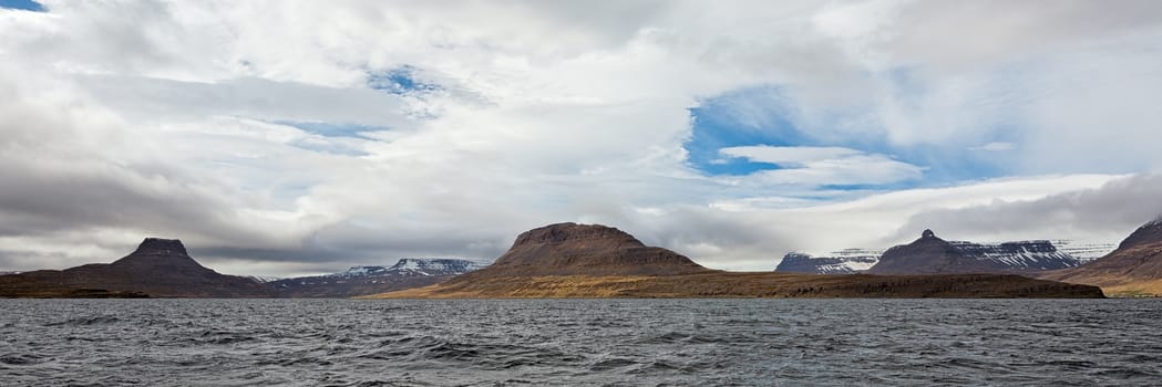 Panoramic mountain view in Isafjordur in a cloudy day, Iceland