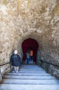 NAPLES, ITALY -MARCH 31, 2012: The entrance of the Catacombs of San Gennaro in the heart of city of Naples, Italy