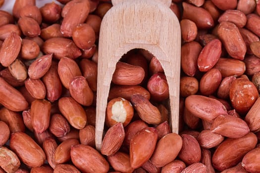 roasted peanuts with spatula close up photo
