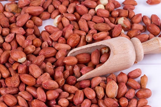 roasted peanuts with spatula close up photo