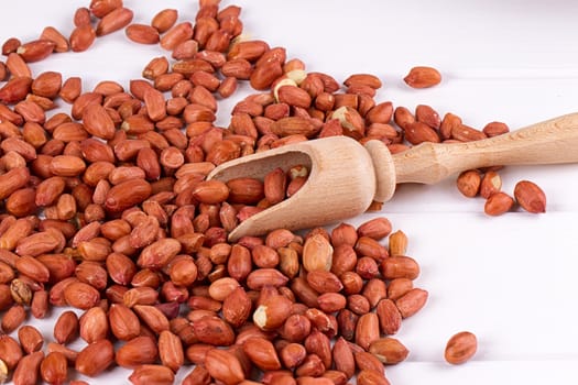 roasted peanuts with spatula close up photo