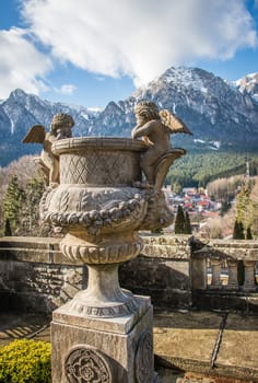 Cantacuzino Castle and the Carpathian Mountains in a sunny day. Residence and museum in a Transylvanian Busteni city, Romania