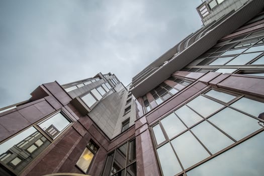 Modern building exterior low angle view with blue sky