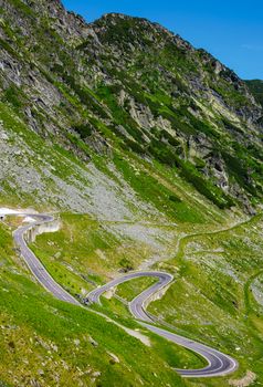 serpentine road in Fagarasan mountains. lovely transportation background. Popular tourist destination of Romania