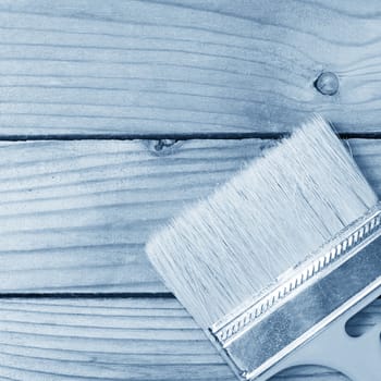 Brush for painting paint on wooden background