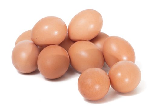 pile of chicken eggs isolated on a white background.