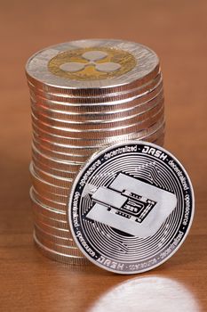 several aligned ripple coins on top of wooden table.