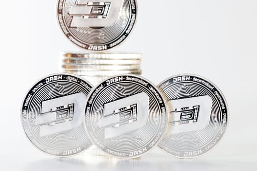 Shiny dash coins on a white background.