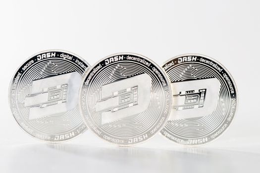 Shiny dash coins on a white background.