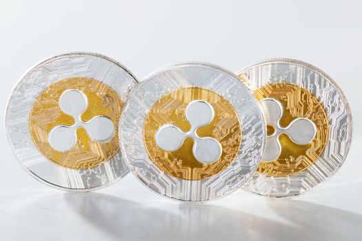 Shiny ripple coins on a white background.