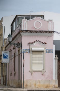Small narrow portuguese building on the city of Faro, Portugal.